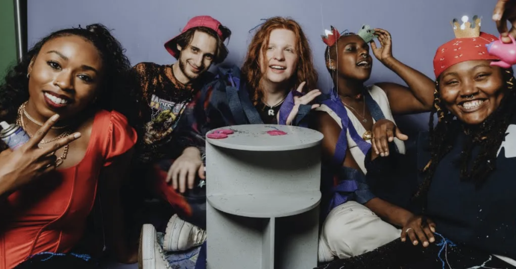 Rubber and friends will take you on a shopping spree in their “Queen Cash” video