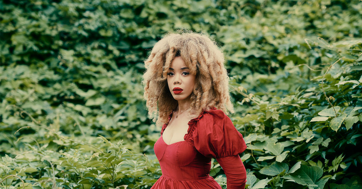 woman standing in wooded area