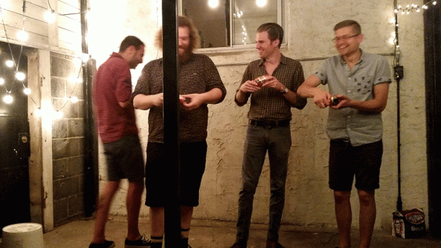Shot-gunning beers in the backyard (photo by the author)