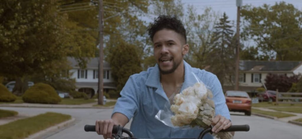 Moses Mosima takes a floral bike ride in the “Full Bloom” video