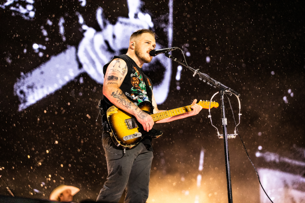 Zach Bryan and fans power through the heavy weather at The Linc